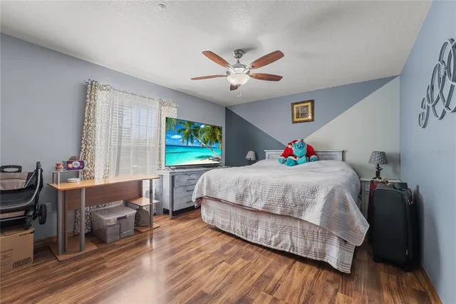 a large kitchen with a table and chairs