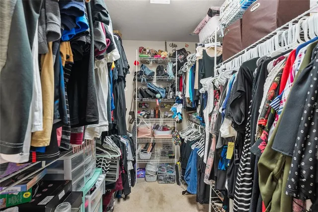 a view of a house with patio and a yard