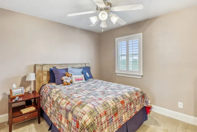 a view of a house with backyard and porch