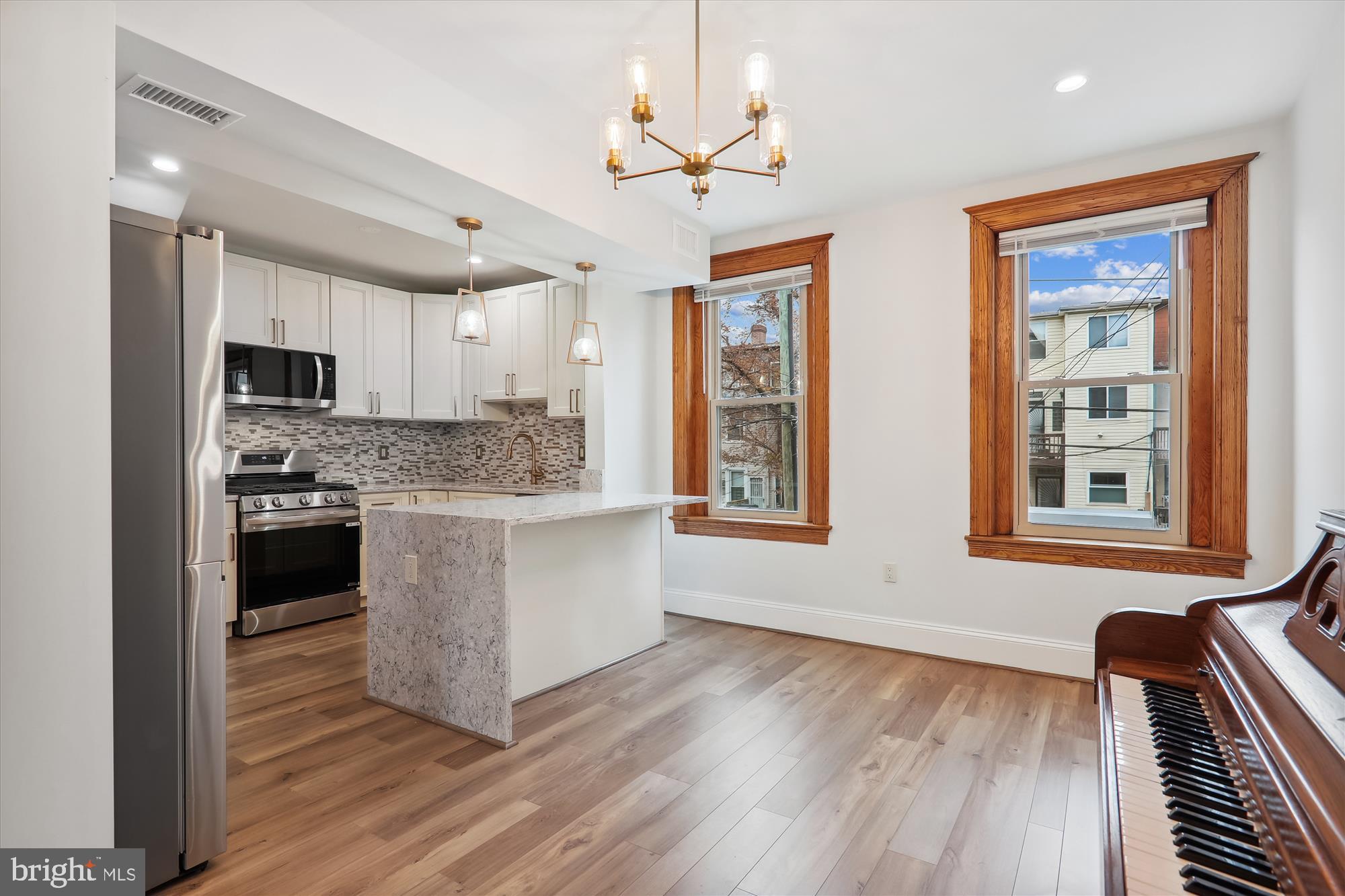 721 Quebec Place Northwest Washington, DC 20010 - Photo 13 of 77 a kitchen with a refrigerator and a stove top oven