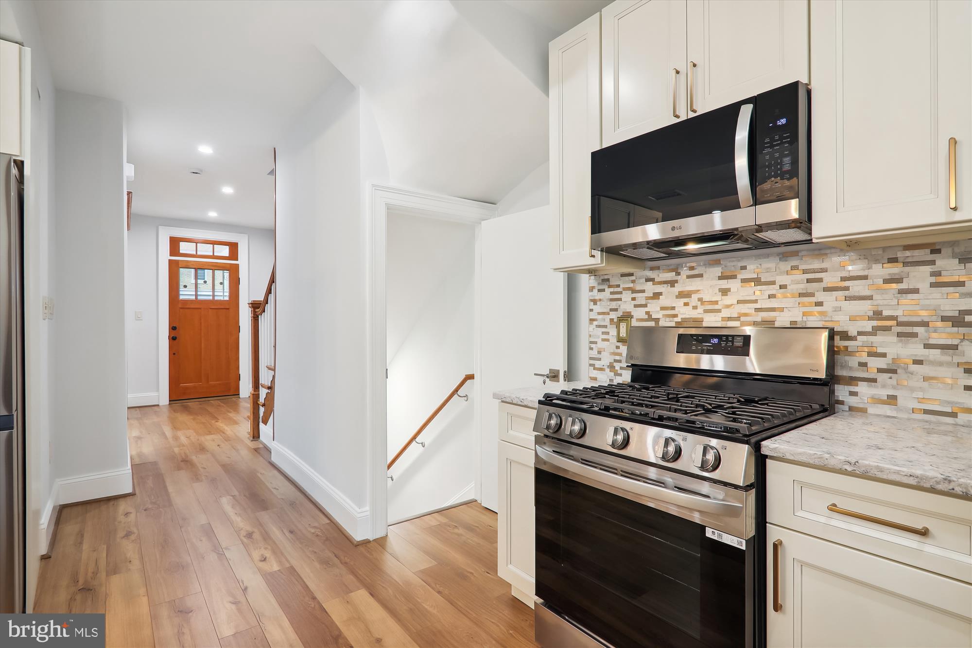 721 Quebec Place Northwest Washington, DC 20010 - Photo 15 of 77 a kitchen with granite countertop a stove and a microwave