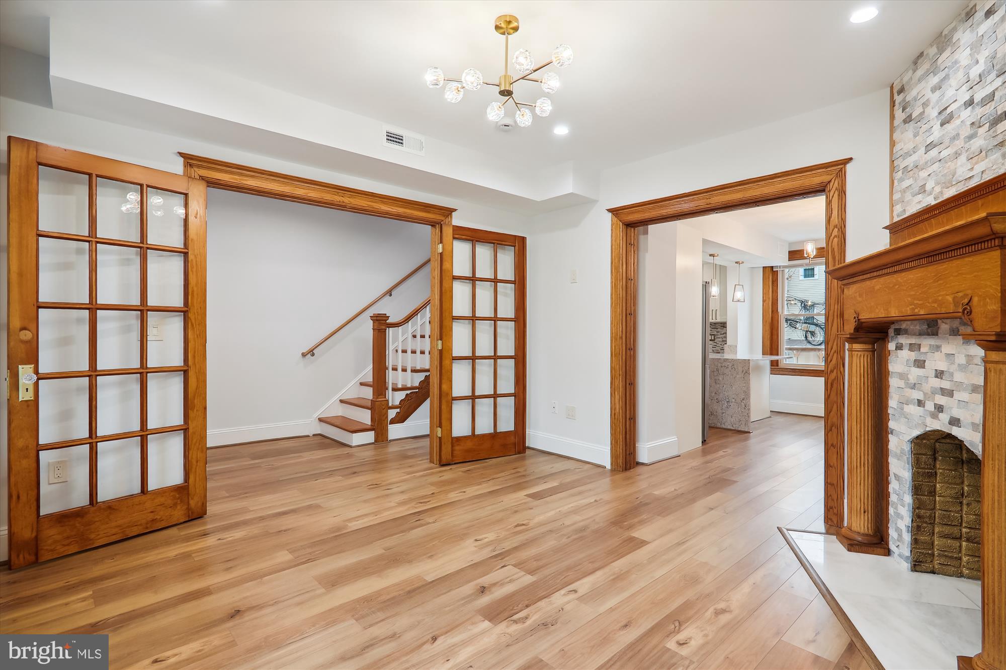 721 Quebec Place Northwest Washington, DC 20010 - Photo 3 of 77 a view of an entryway with wooden floor and a fireplace
