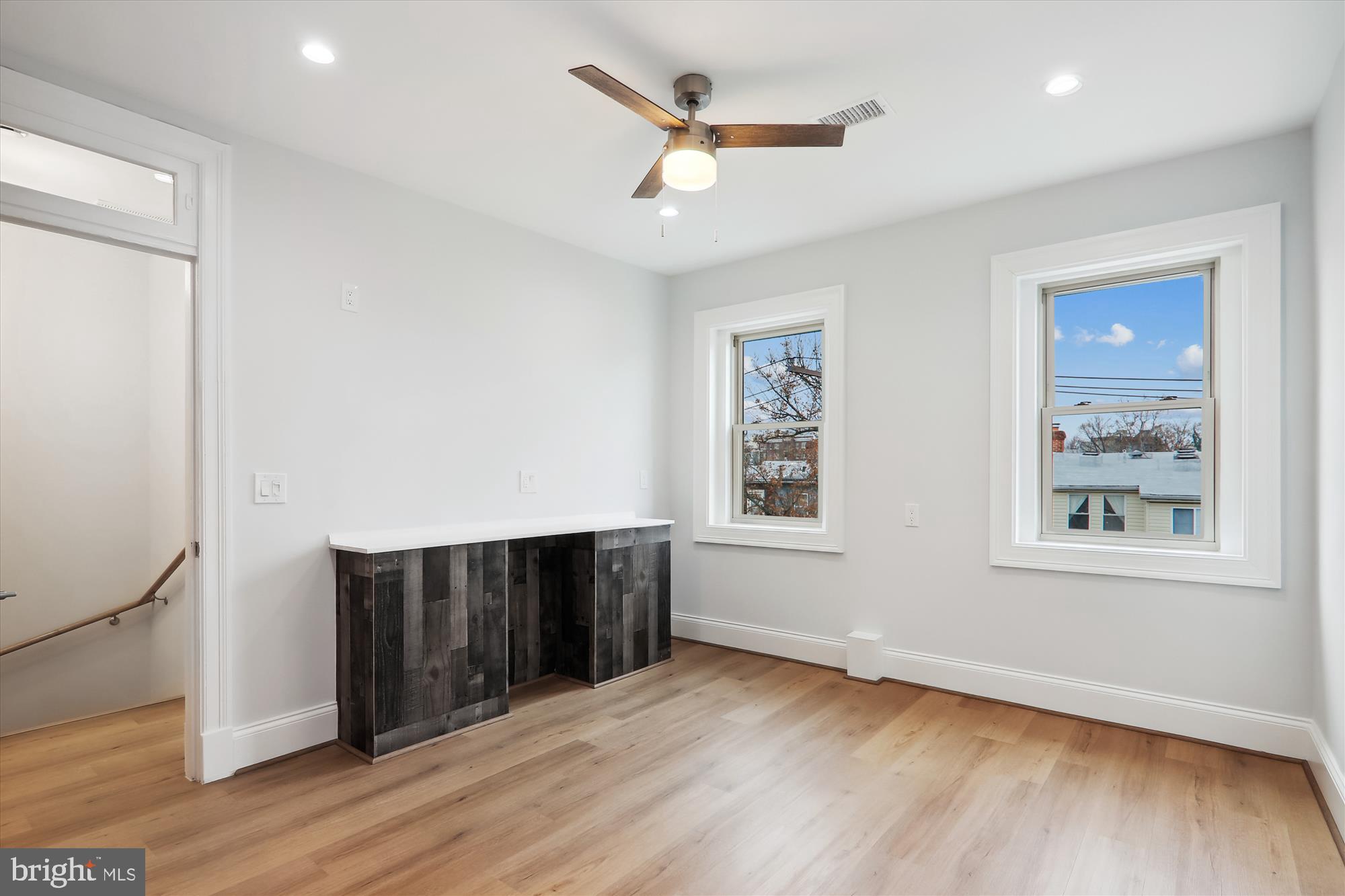 721 Quebec Place Northwest Washington, DC 20010 - Photo 38 of 77 an empty room with wooden floor and windows