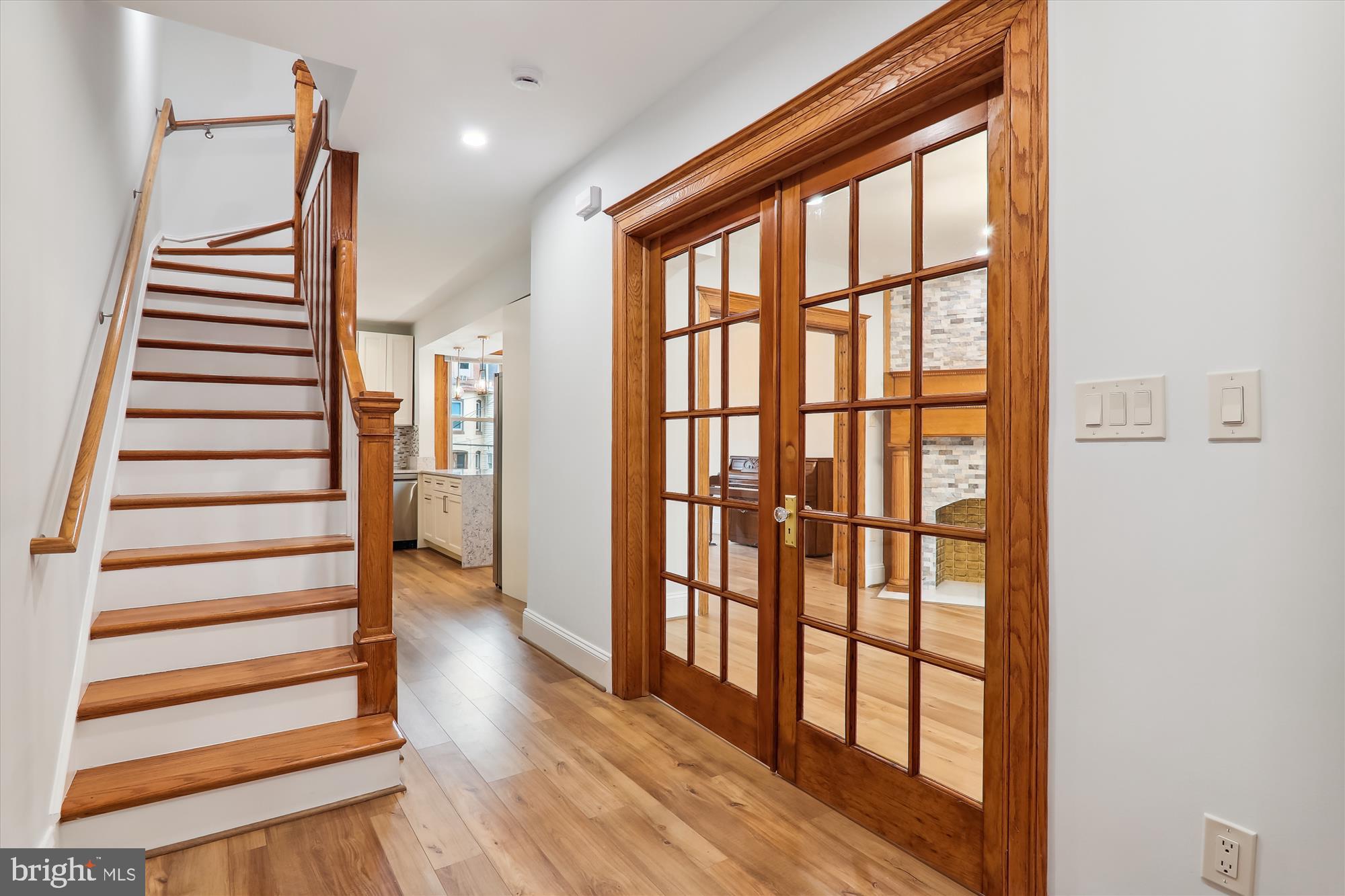 721 Quebec Place Northwest Washington, DC 20010 - Photo 4 of 77 a view of entryway with wooden floor and stairs