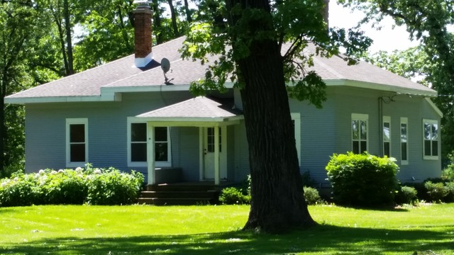 18715 A West Edwards Road Antioch, IL 60002 - Photo 1 of 1 a view of a white house with a yard and potted plants