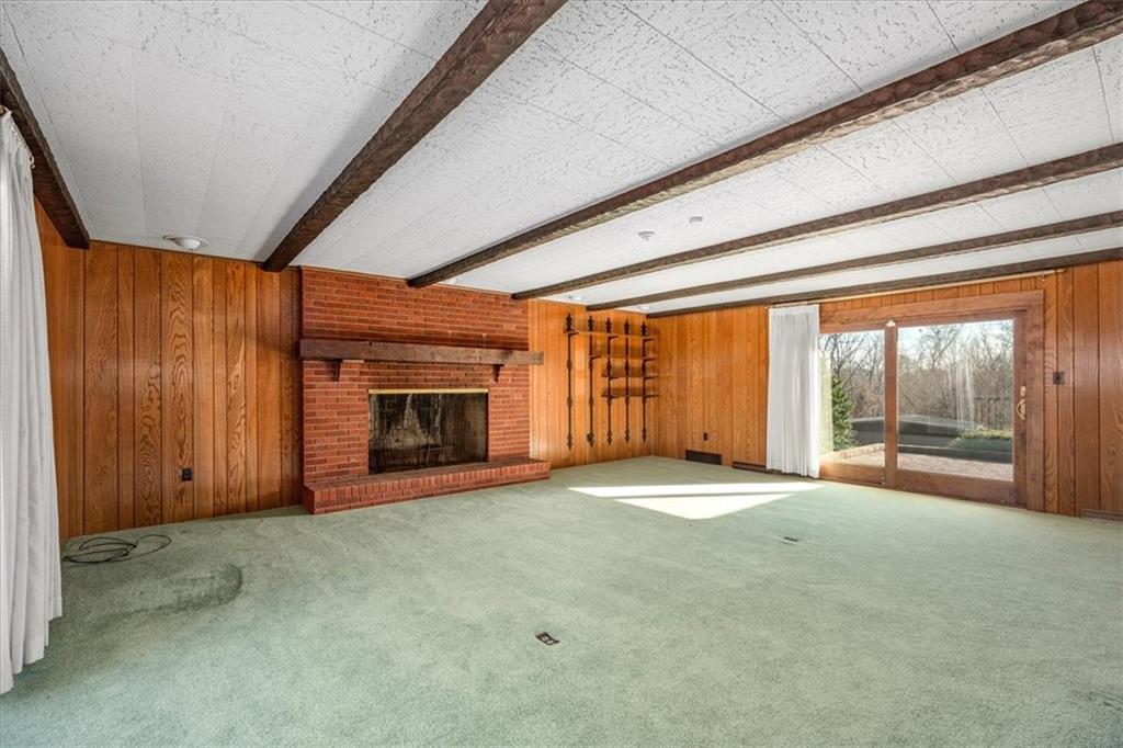 1925 Tuscarawas Road Beaver, PA 15009 - Photo 8 of 44 a view of an empty room with a fireplace and a window