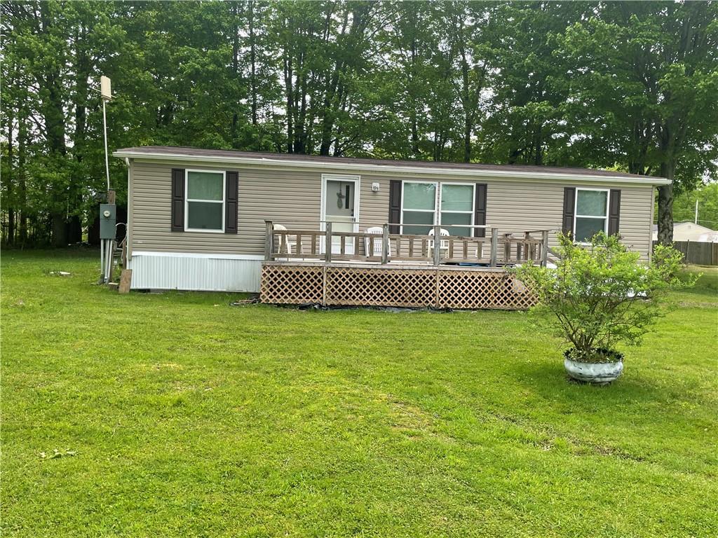 14624 Gilliland Road Linesville, PA 16424 - Photo 1 of 23 a front view of house with yard and green space