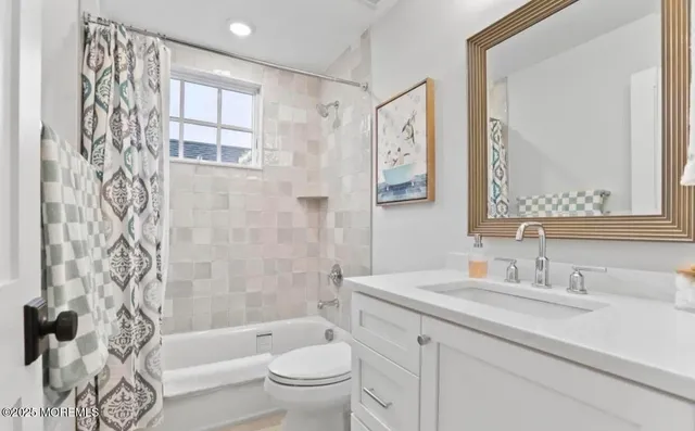 a bathroom with a sink a toilet and a bathtub