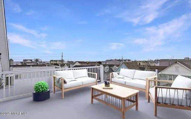 a view of a terrace with couches and potted plants