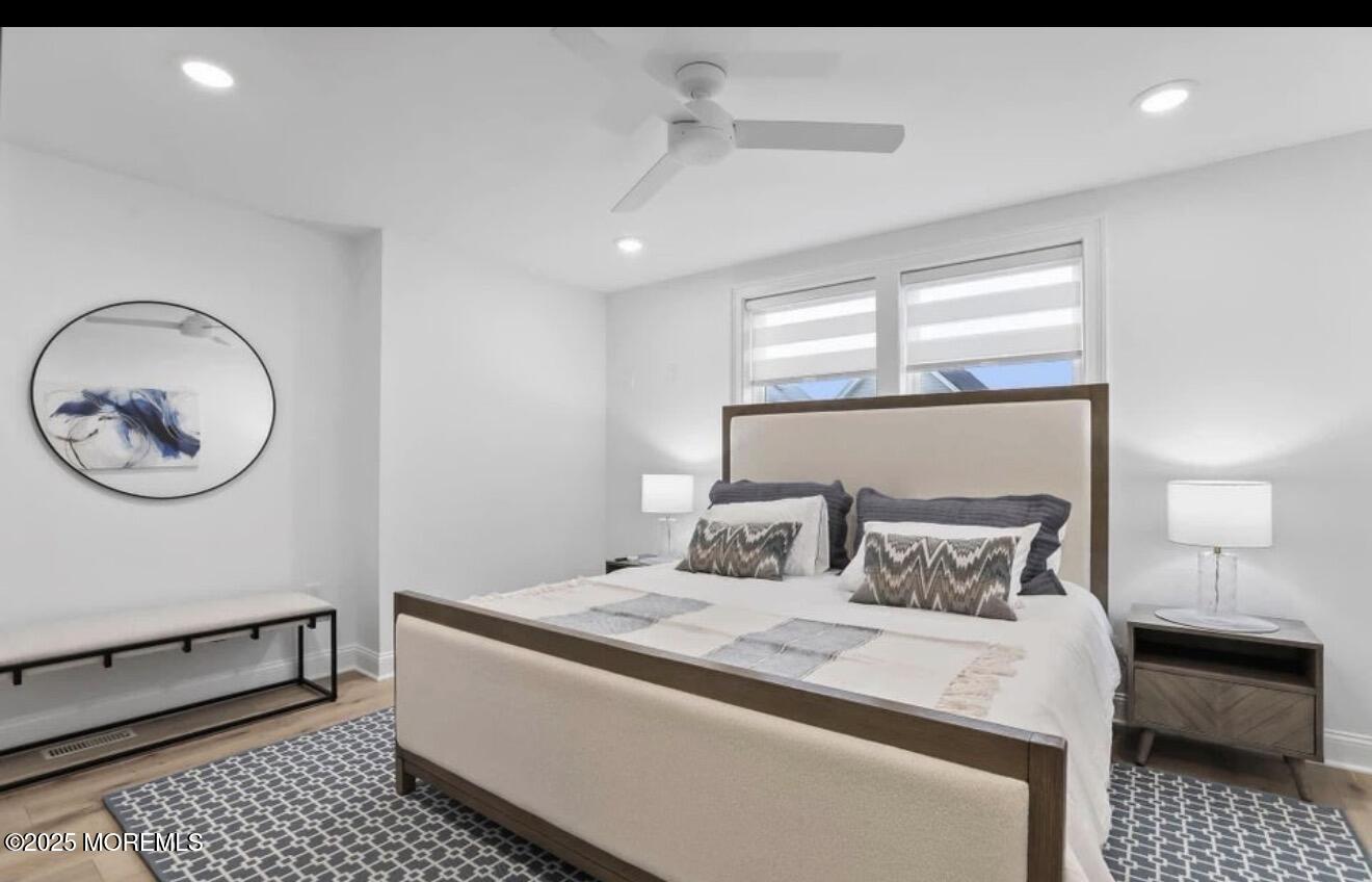 7 Center Street, Unit JUNE Sea Bright, NJ 07760 - Photo 8 of 19 a bedroom with a bed and a window