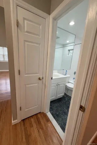 a bathroom with a sink a toilet and a shower