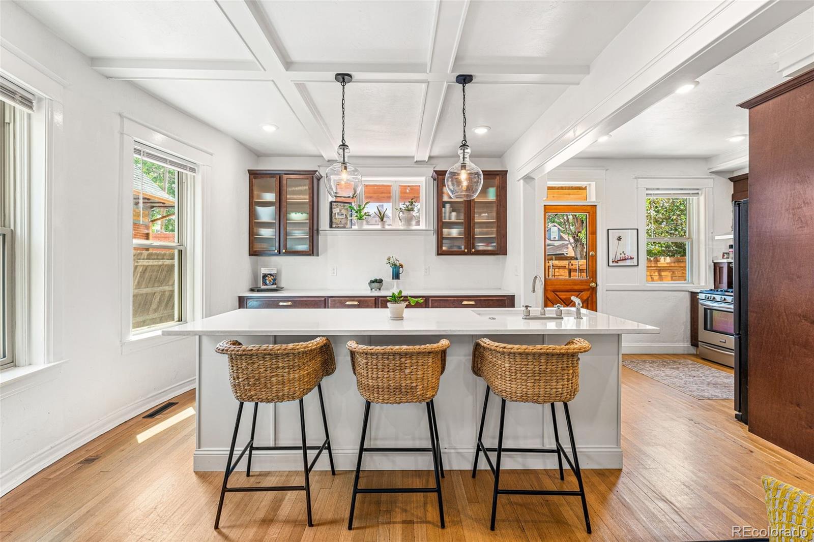 4425 Alcott Street Denver, CO 80211 - Photo 12 of 40 a kitchen with a table chairs and wooden floor