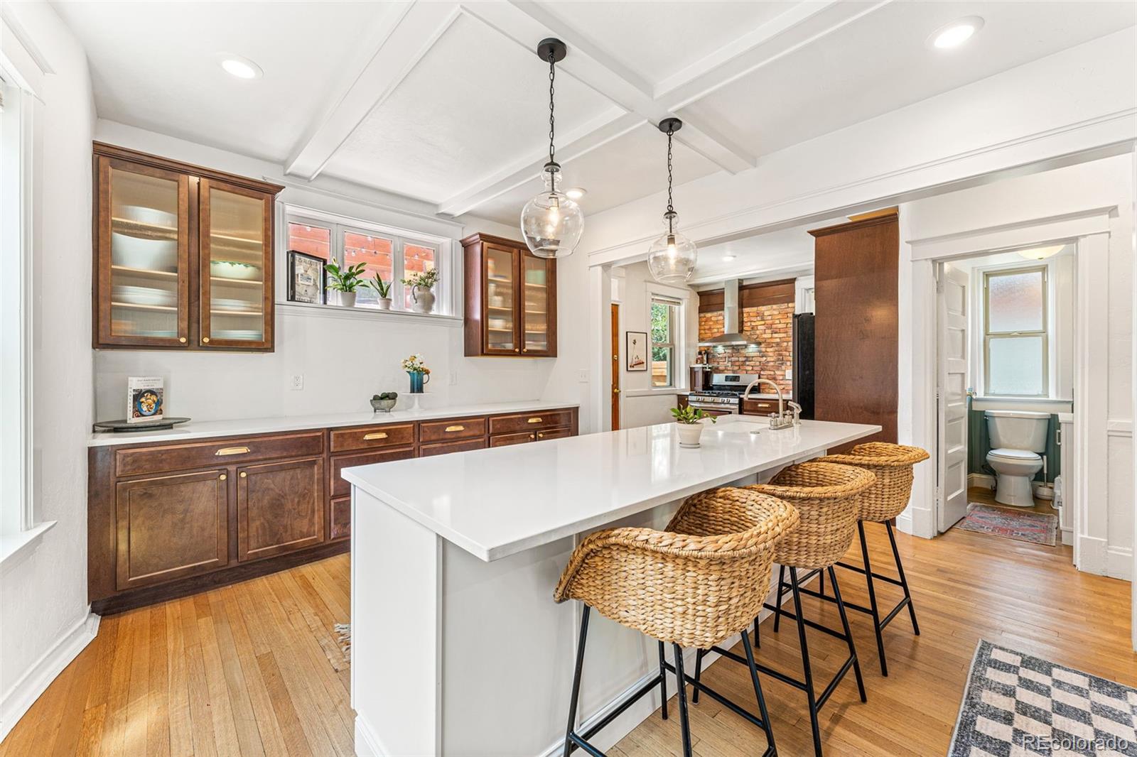 4425 Alcott Street Denver, CO 80211 - Photo 13 of 40 a large kitchen with a table and chairs in it