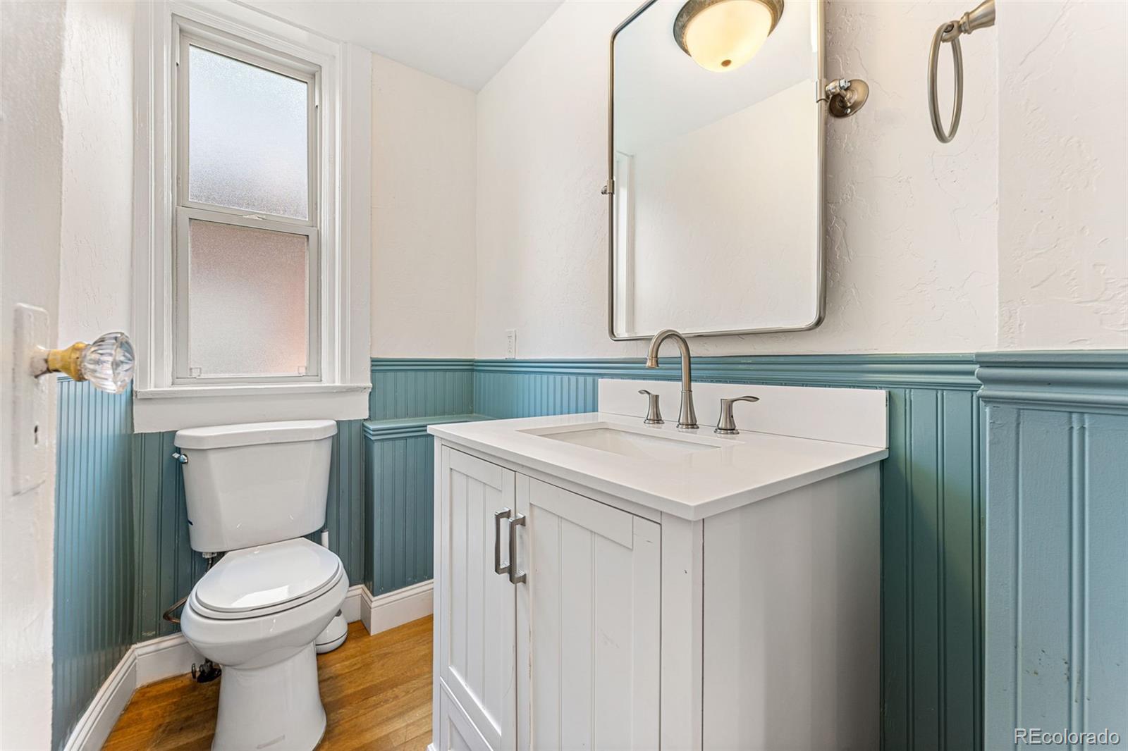4425 Alcott Street Denver, CO 80211 - Photo 19 of 40 a bathroom with a sink and a toilet