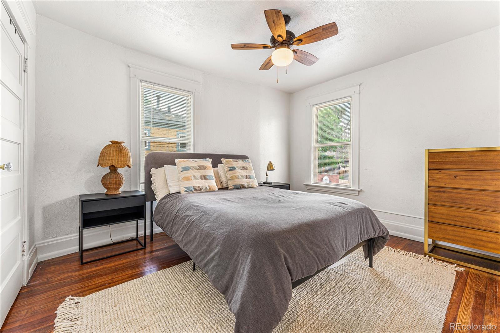 4425 Alcott Street Denver, CO 80211 - Photo 20 of 40 a bedroom with a bed a window and a lamp