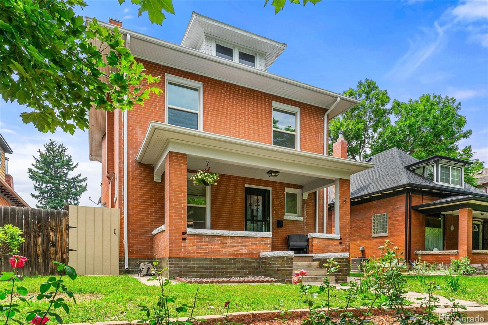 4425 Alcott Street Denver, CO 80211 - Photo 2 of 40 a front view of a house with garden