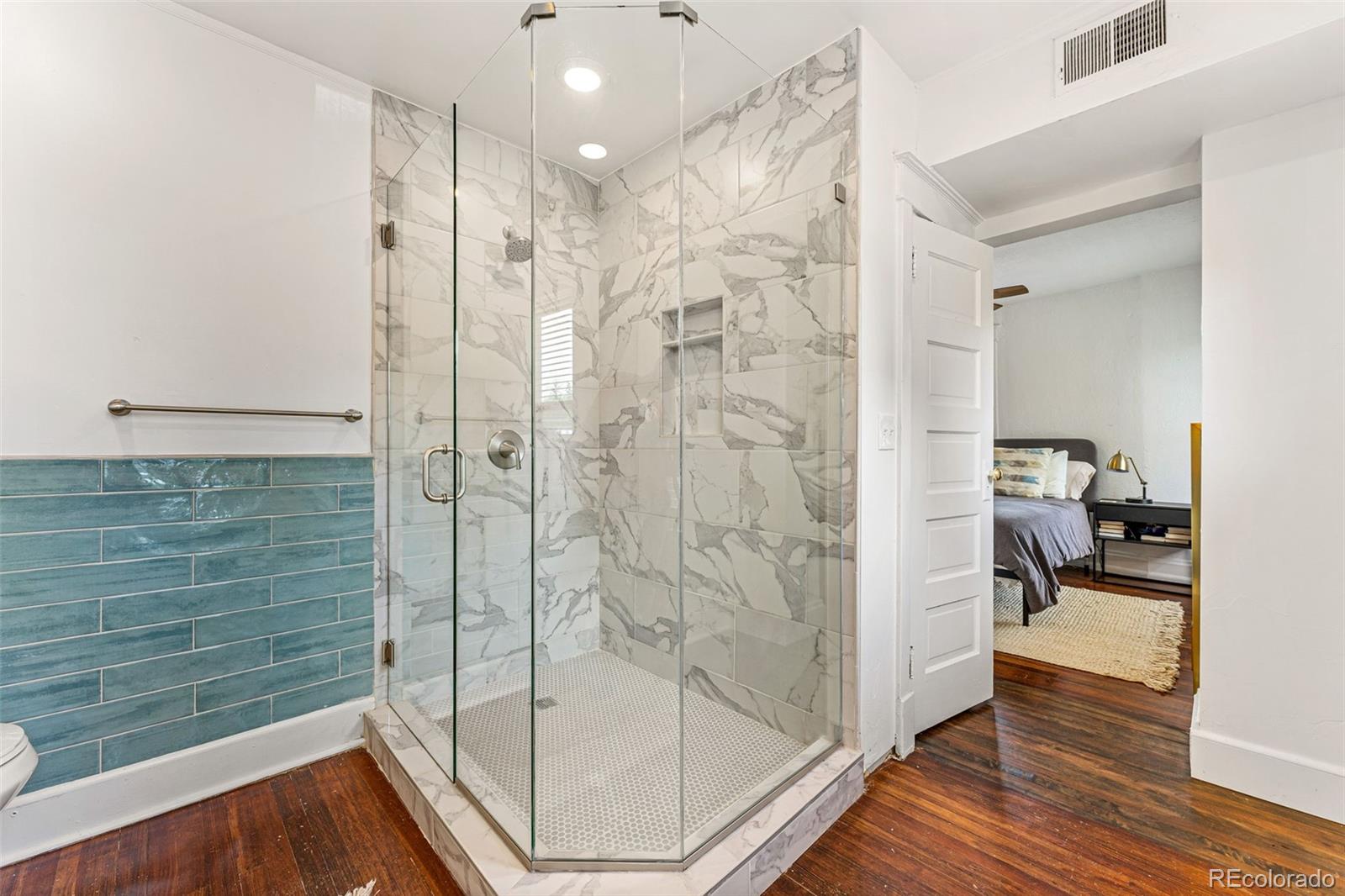 4425 Alcott Street Denver, CO 80211 - Photo 26 of 40 a bathroom with a shower and a sink