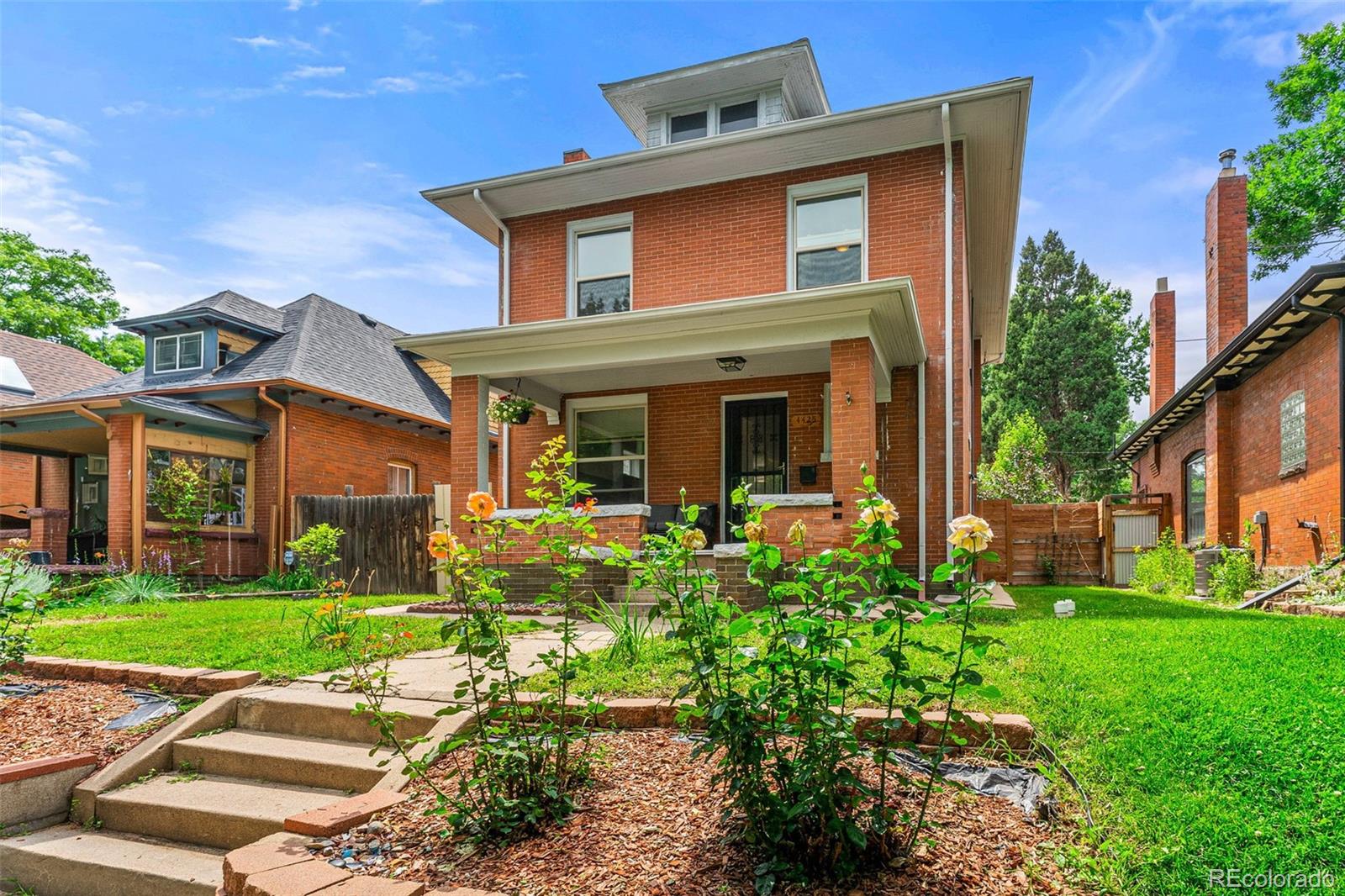 4425 Alcott Street Denver, CO 80211 - Photo 3 of 40 a front view of a house with garden