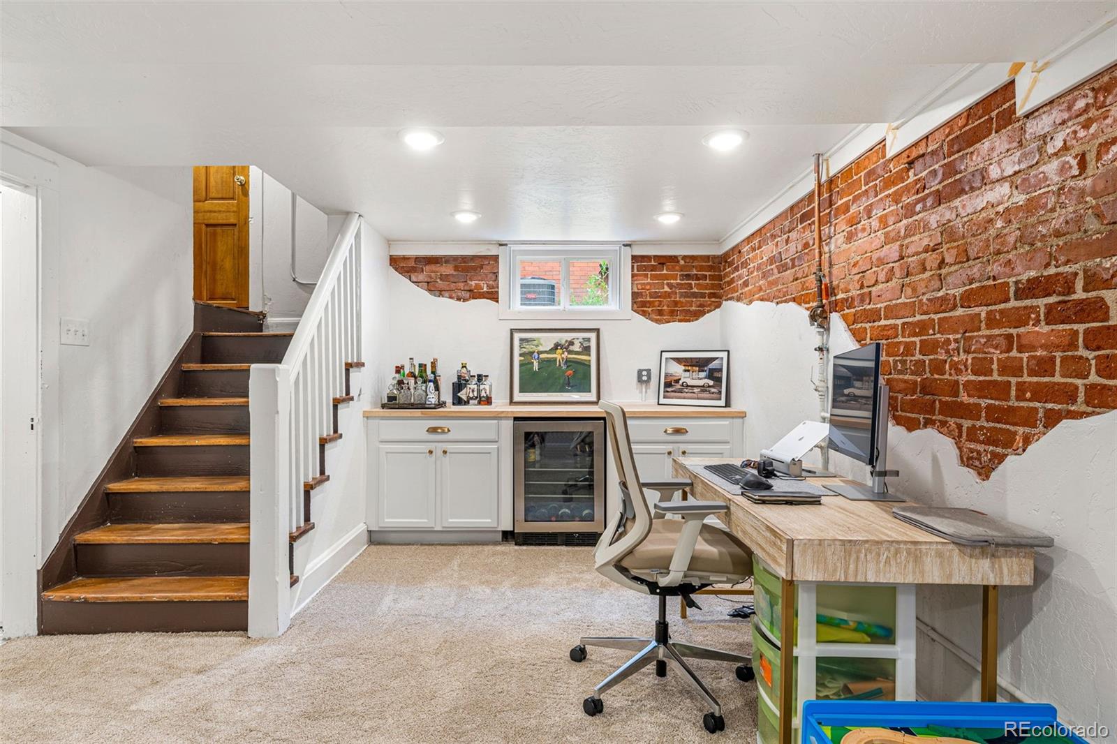 4425 Alcott Street Denver, CO 80211 - Photo 34 of 40 a view of a workspace with furniture and stairs