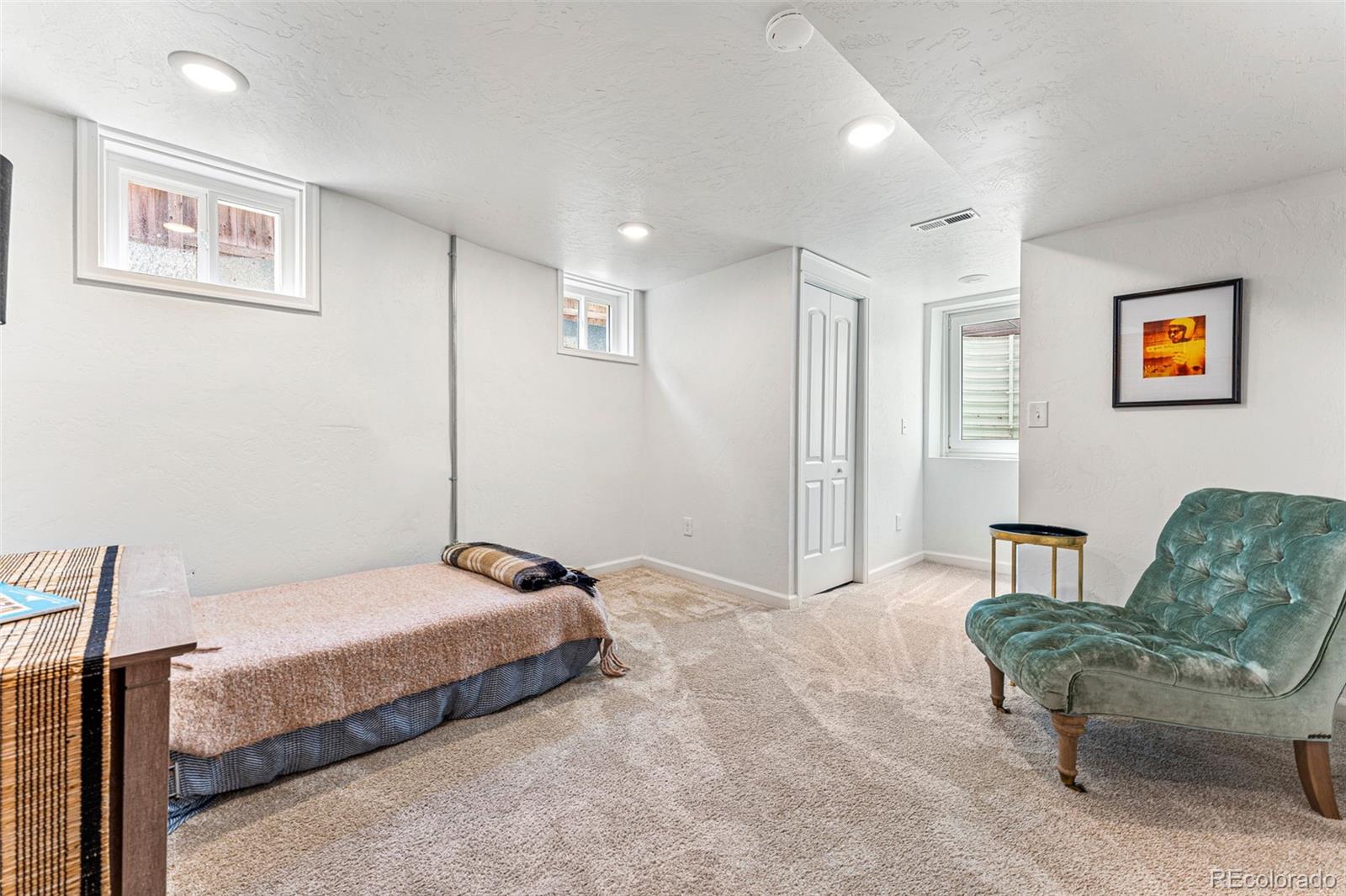 4425 Alcott Street Denver, CO 80211 - Photo 35 of 40 a bedroom with a bed and a couch