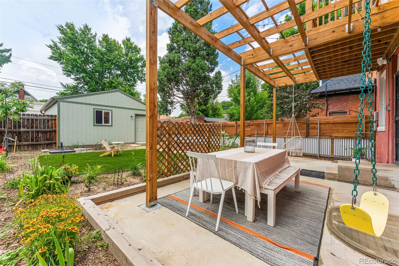 4425 Alcott Street Denver, CO 80211 - Photo 39 of 40 a view of a patio with couches table and chairs and potted plants