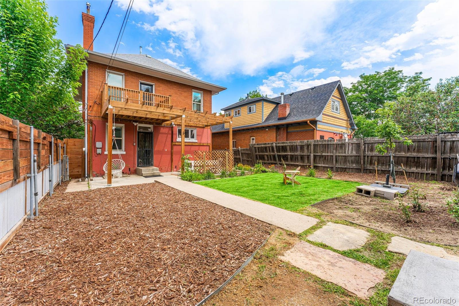 4425 Alcott Street Denver, CO 80211 - Photo 40 of 40 a view of a house with a yard and pathway