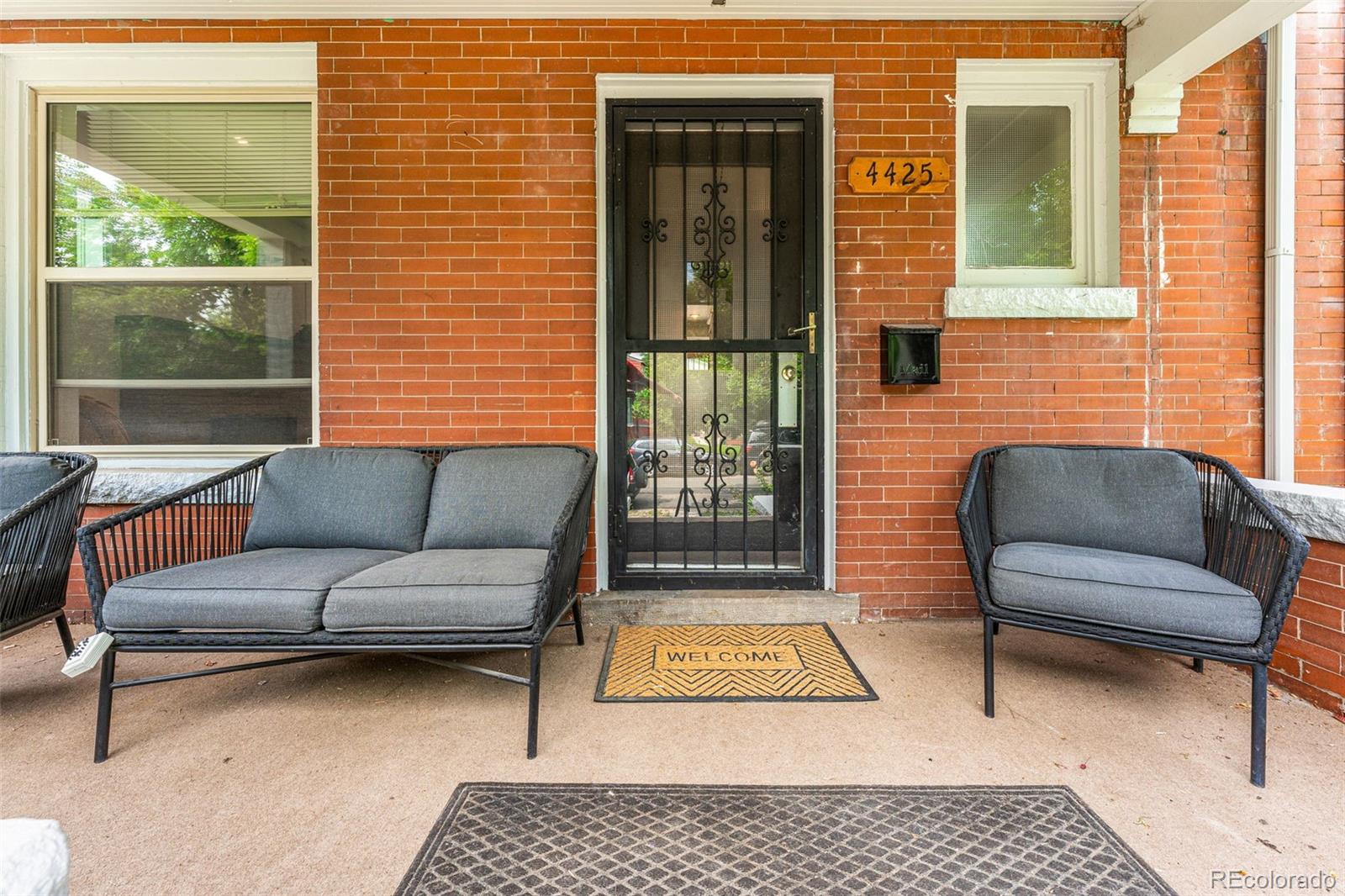 4425 Alcott Street Denver, CO 80211 - Photo 5 of 40 a outdoor living space with furniture and a rug