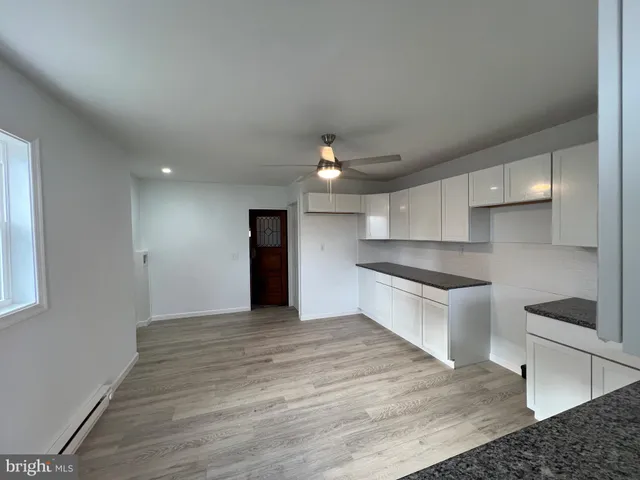 a view of a door and window in a room