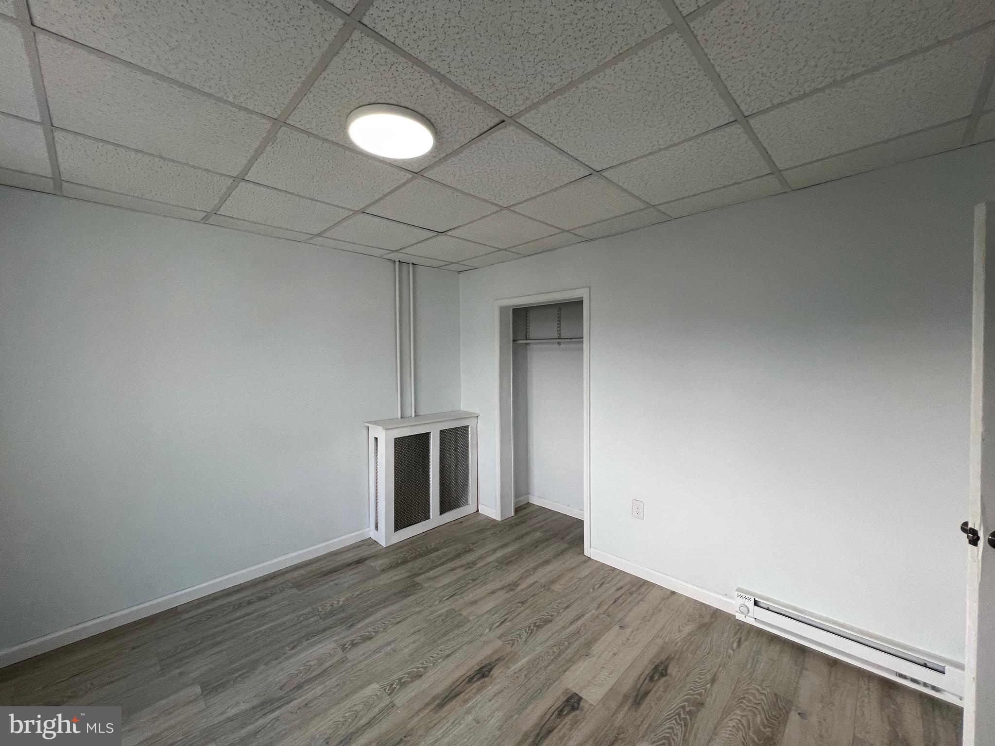 405 North Front Street Minersville, PA 17954 - Photo 18 of 32 a view of empty room with wooden floor and fireplace