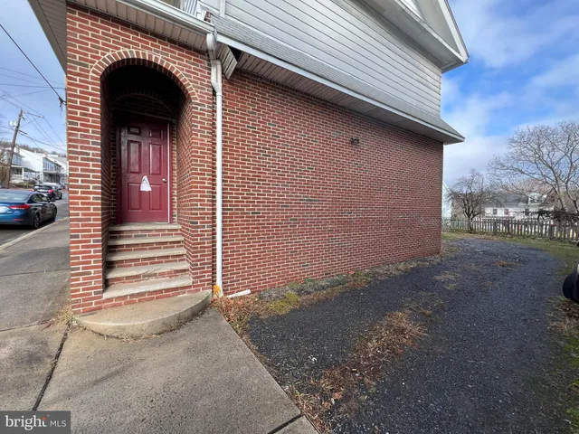a view of a house with a door and a window