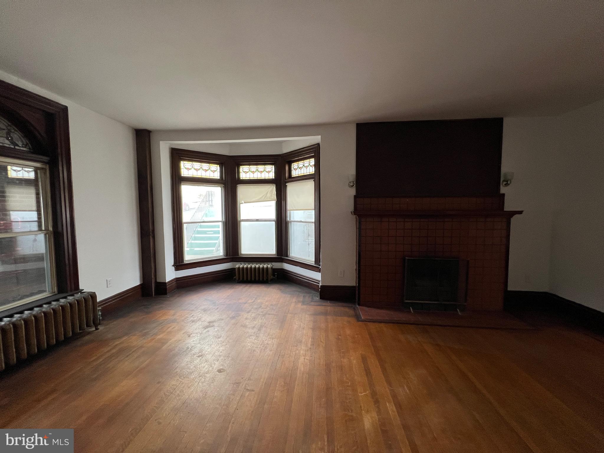 405 North Front Street Minersville, PA 17954 - Photo 32 of 32 a view of an empty room with wooden floor and a window