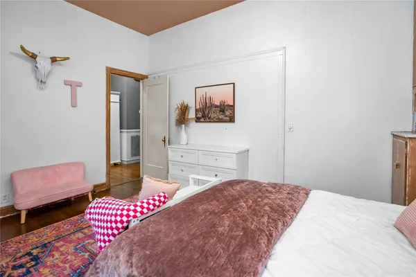 a bedroom with a bed and a couch