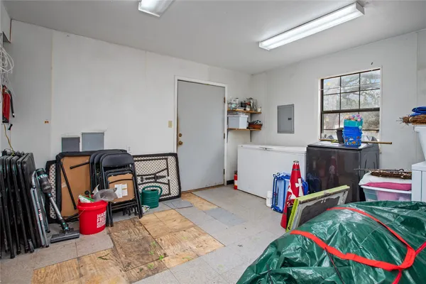 a bedroom with furniture and a flat screen tv