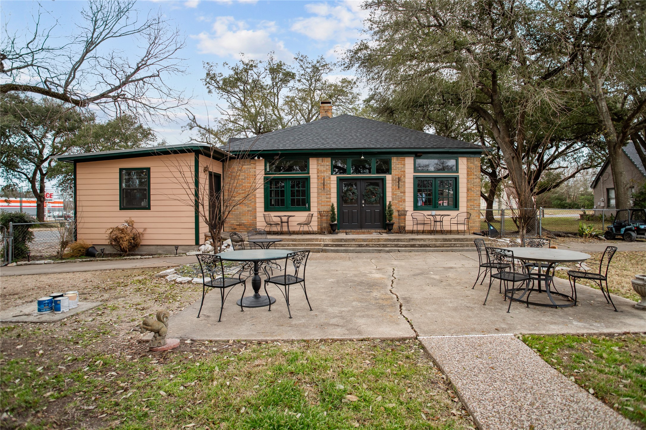 706 East Main Street Madisonville, TX 77864 - Photo 3 of 25 a backyard of a house with table and chairs