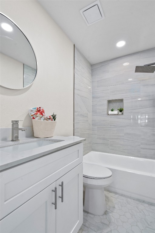 6901 Windrift Way Austin, TX 78745 - Photo 13 of 30 Full bath with vanity, recessed lighting, and bathtub / shower combination