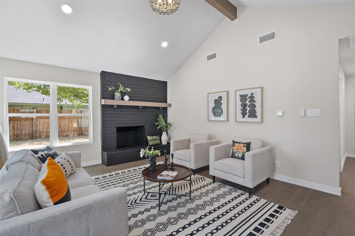 6901 Windrift Way Austin, TX 78745 - Photo 14 of 30 Living area featuring beamed ceiling, a fireplace, dark wood finished floors, high vaulted ceiling, and recessed lighting