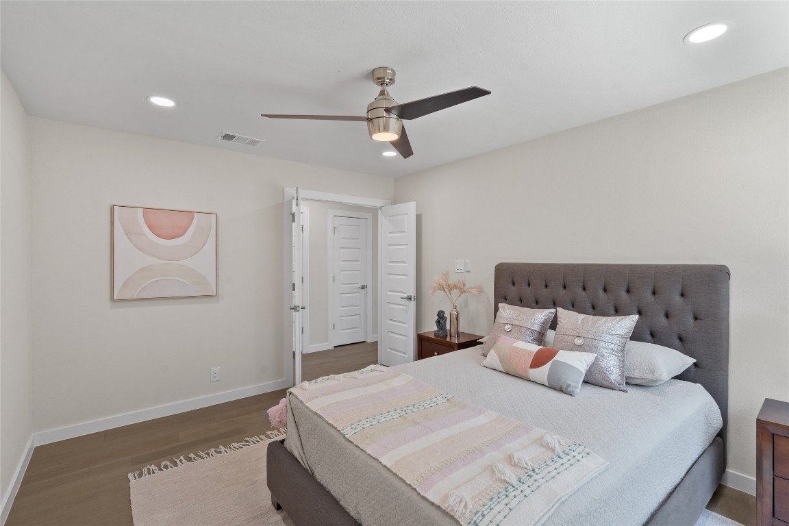 6901 Windrift Way Austin, TX 78745 - Photo 18 of 30 Bedroom with recessed lighting, wood finished floors, and a ceiling fan