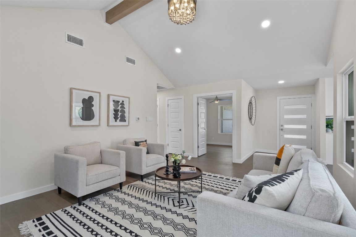6901 Windrift Way Austin, TX 78745 - Photo 21 of 30 Living area with beam ceiling, high vaulted ceiling, wood finished floors, recessed lighting, and a chandelier