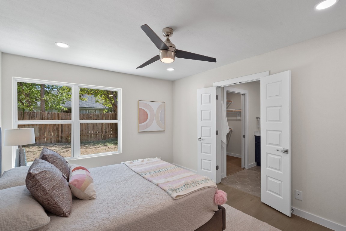 6901 Windrift Way Austin, TX 78745 - Photo 24 of 30 Bedroom with recessed lighting, a ceiling fan, and wood finished floors