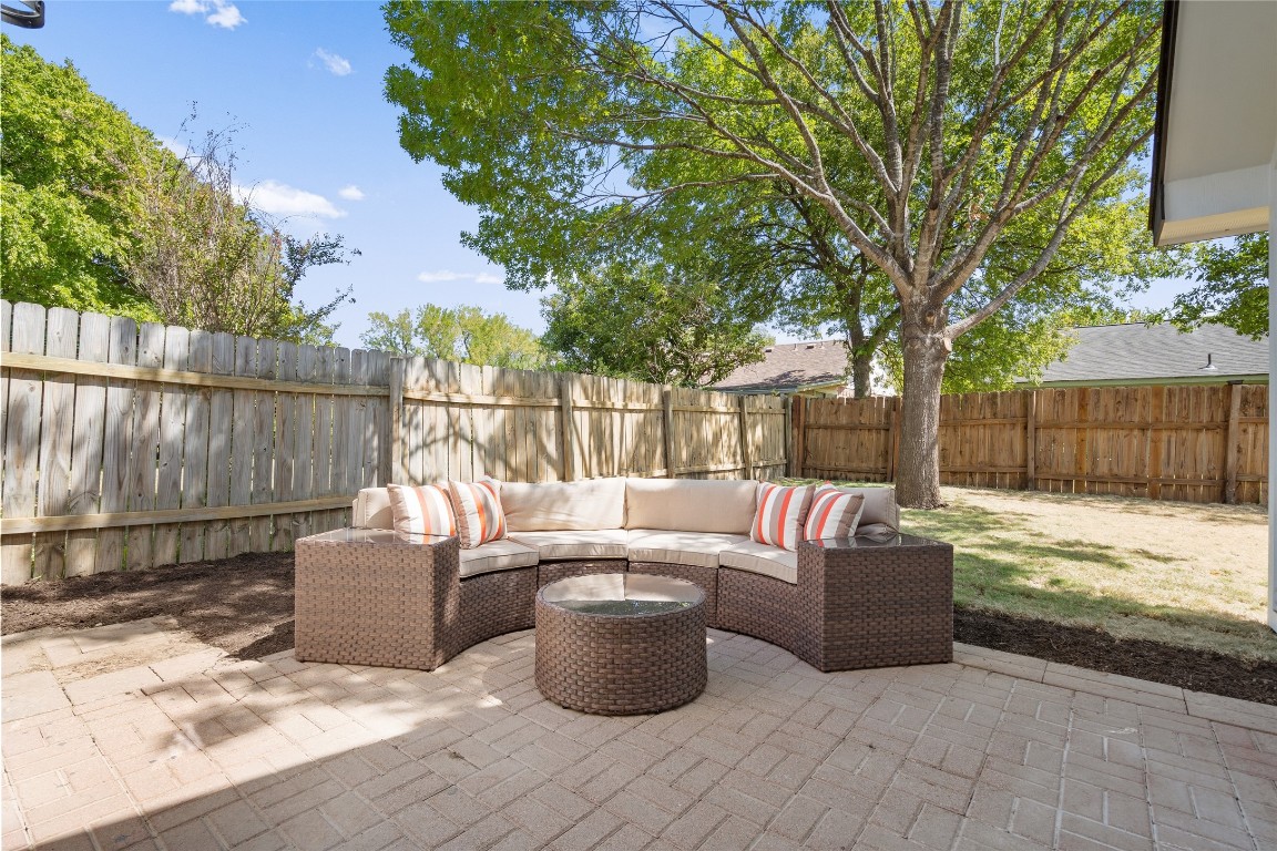 6901 Windrift Way Austin, TX 78745 - Photo 27 of 30 Fenced backyard with a patio area and outdoor lounge area