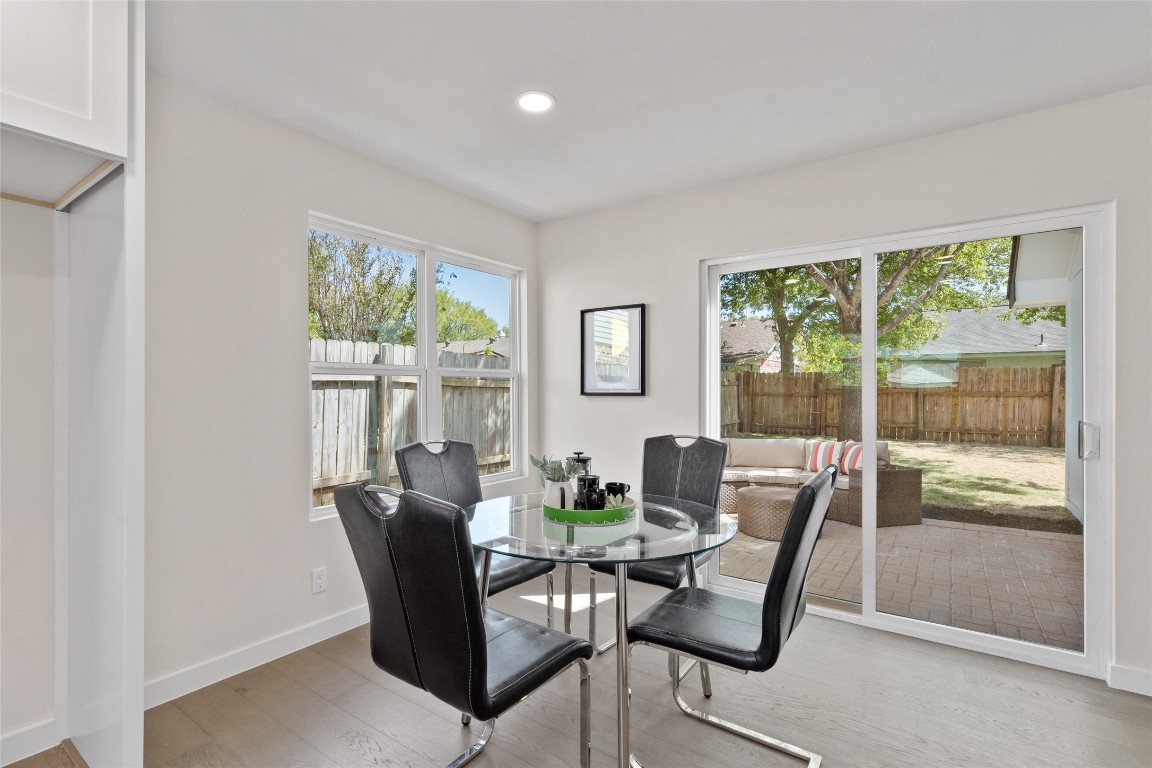 6901 Windrift Way Austin, TX 78745 - Photo 7 of 30 Dining area with light wood-style floors and recessed lighting
