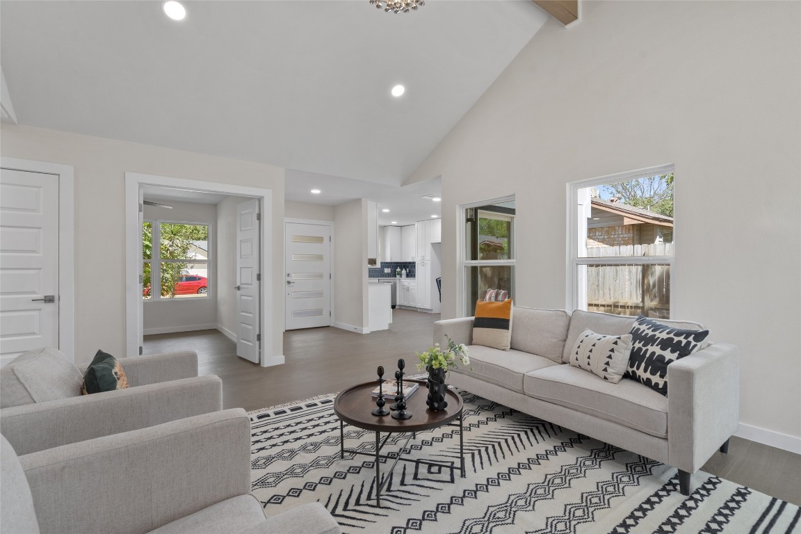 6901 Windrift Way Austin, TX 78745 - Photo 10 of 30 Living room featuring high vaulted ceiling, wood finished floors, recessed lighting, and beamed ceiling