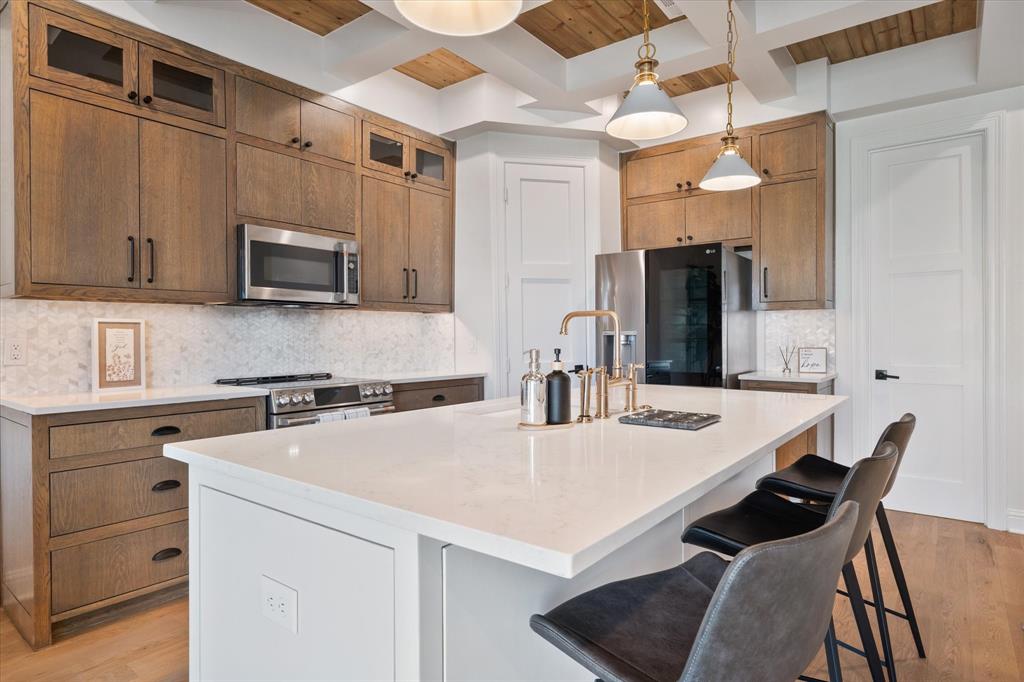 2108 Psalm Circle Heath, TX 75126 - Photo 22 of 39 a kitchen with a dining table and chairs