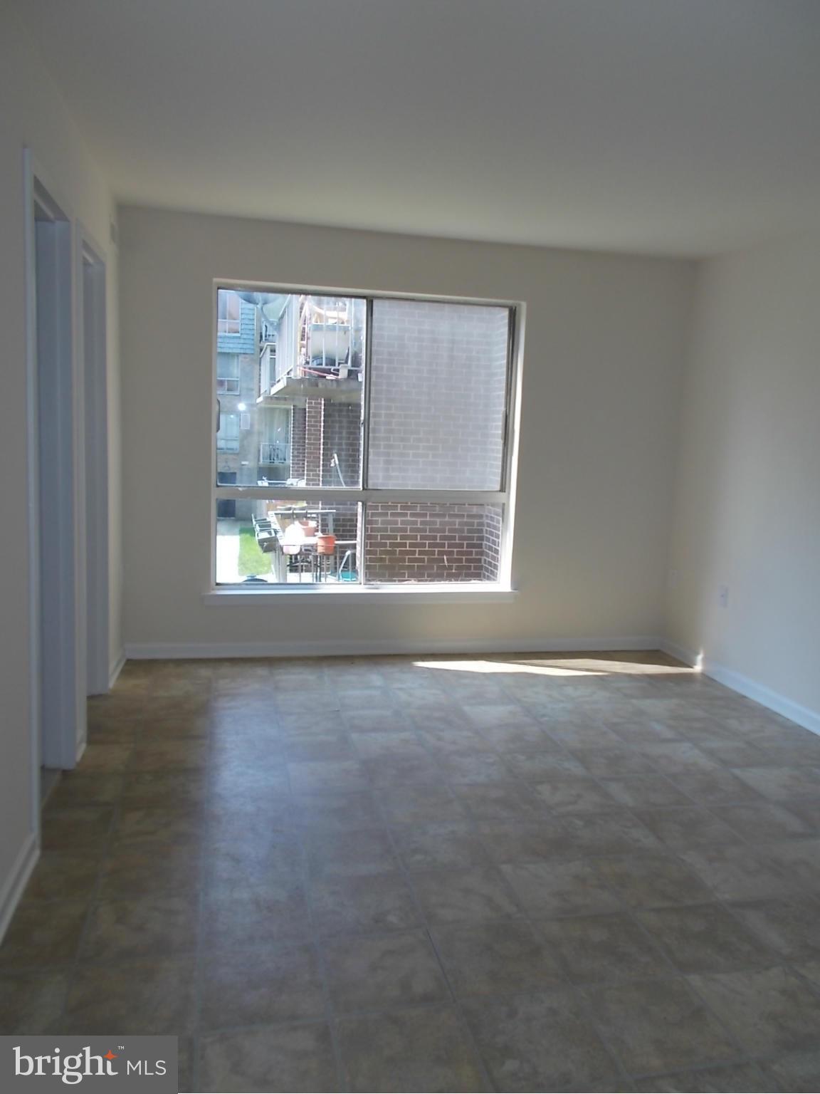 3934 Bel Pre Road, Unit 6 Silver Spring, MD 20906 - Photo 11 of 16 a view of an empty room with a window