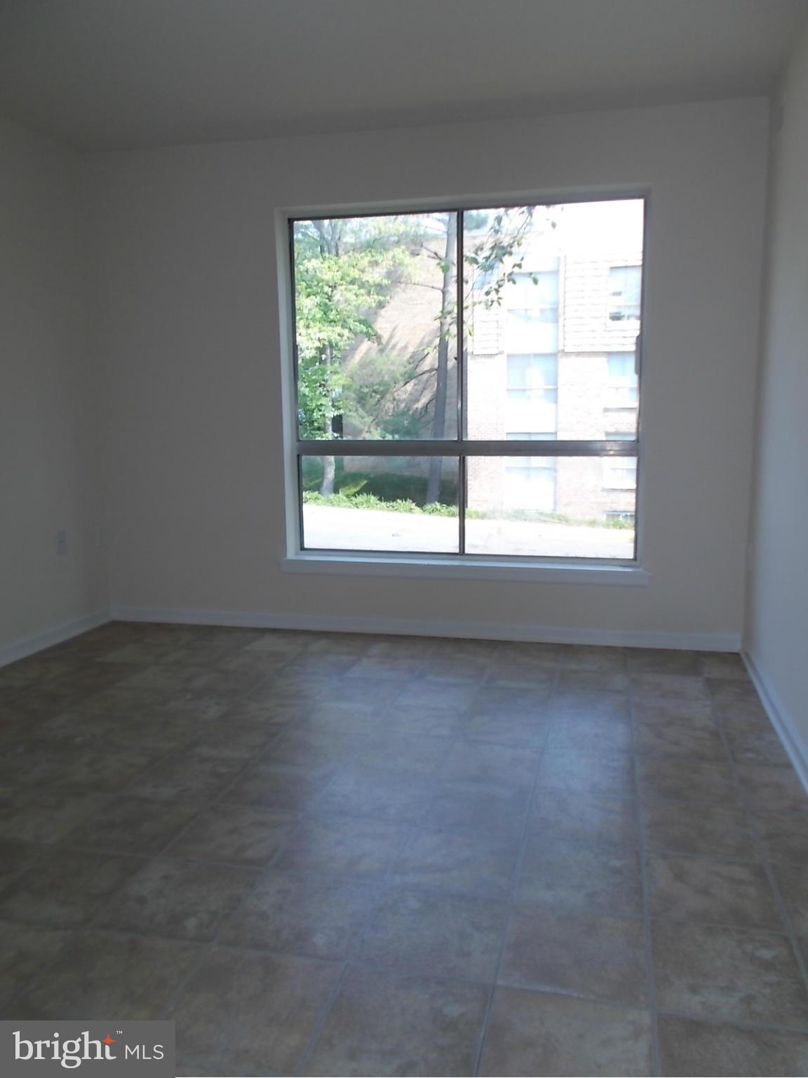3934 Bel Pre Road, Unit 6 Silver Spring, MD 20906 - Photo 15 of 16 an empty room with a window