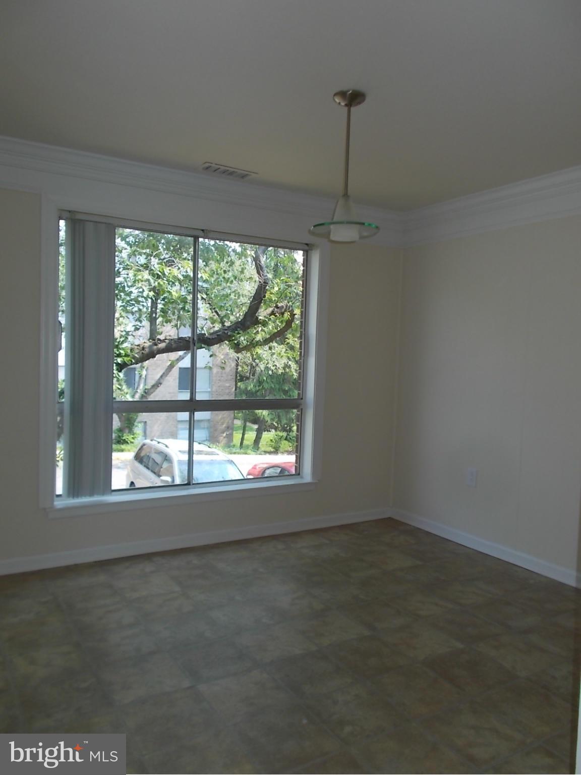 3934 Bel Pre Road, Unit 6 Silver Spring, MD 20906 - Photo 5 of 16 a view of an empty room with a window