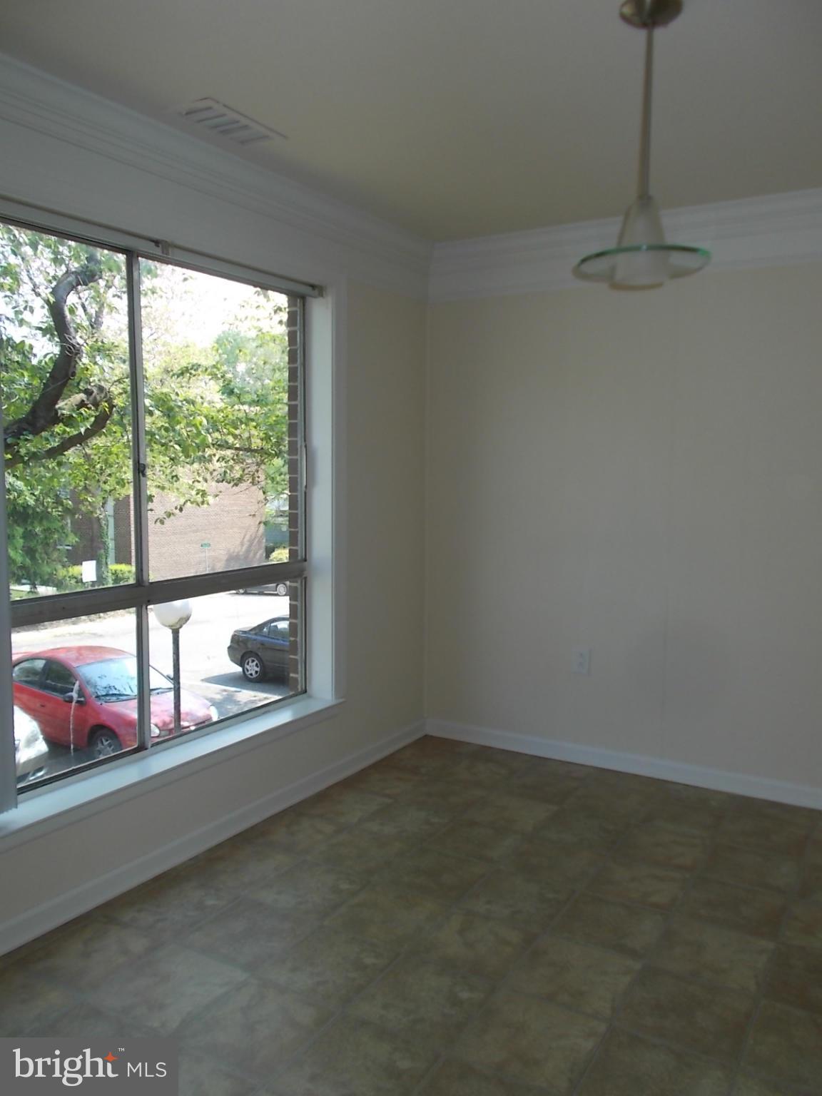 3934 Bel Pre Road, Unit 6 Silver Spring, MD 20906 - Photo 6 of 16 a view of an empty room with a window