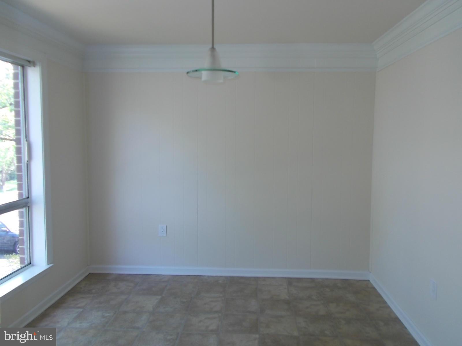 3934 Bel Pre Road, Unit 6 Silver Spring, MD 20906 - Photo 7 of 16 a view of an empty room with a window