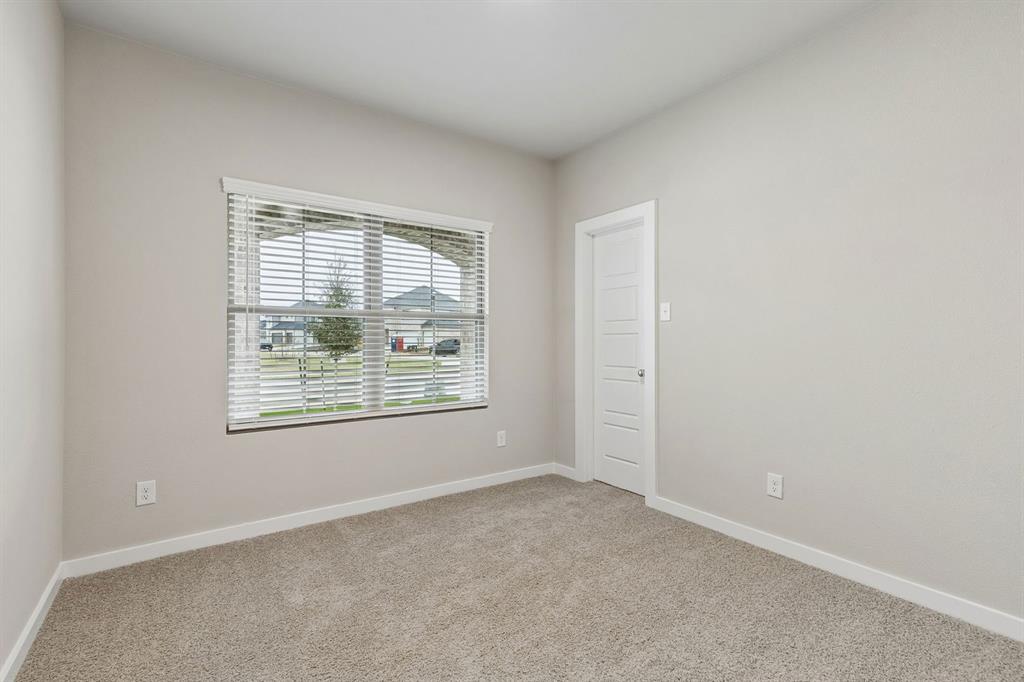 1124 Del Rio Drive Lavon, TX 75166 - Photo 23 of 32 Bedroom in the Emmy II home plan by Trophy Signature Homes - REPRESENTATIVE PHOTO