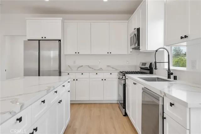 a bathroom with a toilet a sink a mirror a shower and vanity